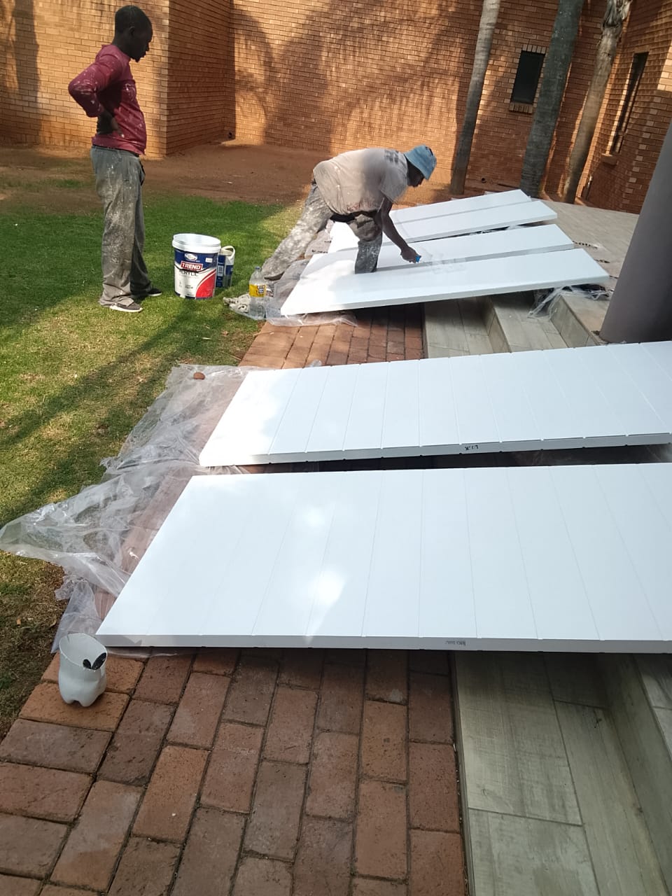 workers painting doors