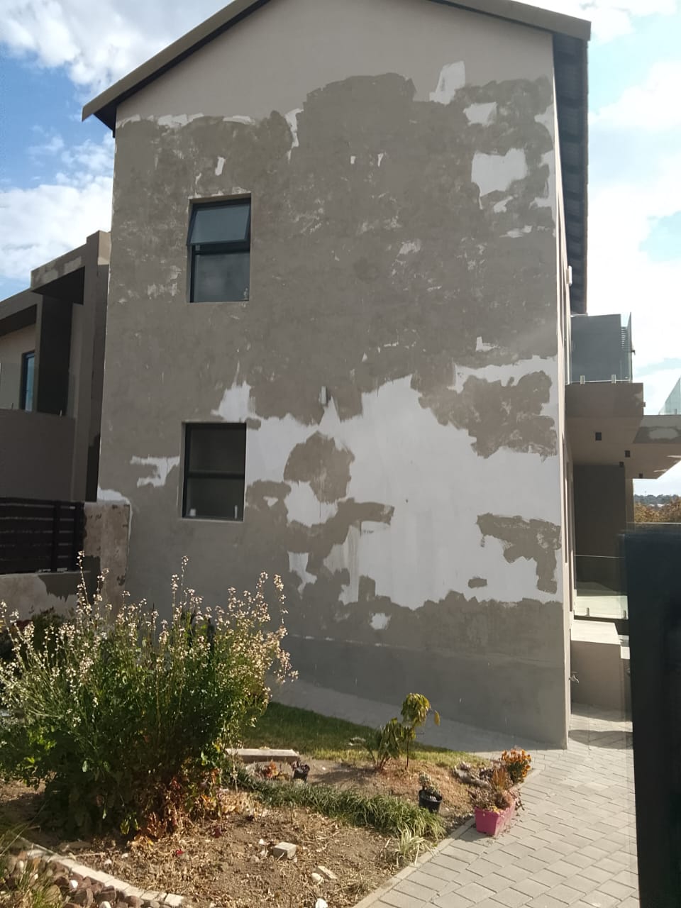 exterior of three storey building unpainted