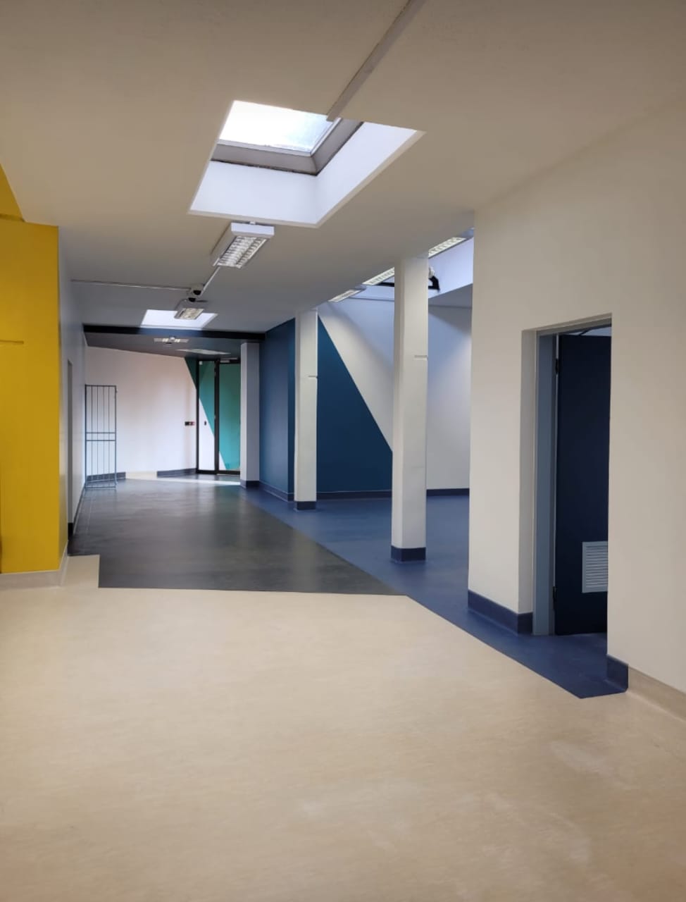 commercial property interior painted white add blue