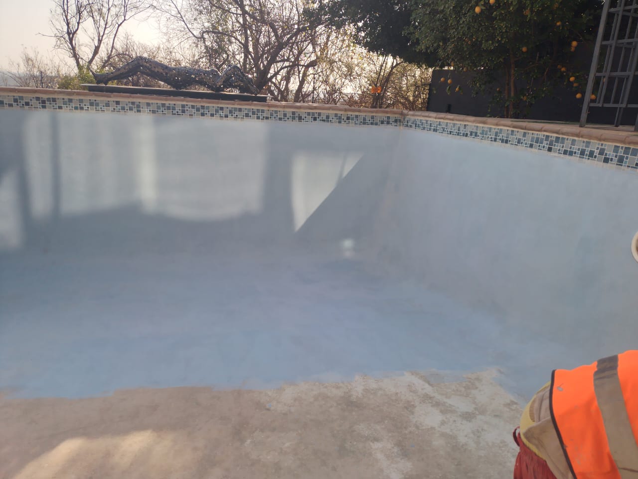 empty pool being resurfaced