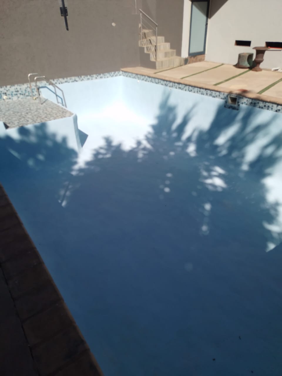 empty pool with resurfacing nearly complete